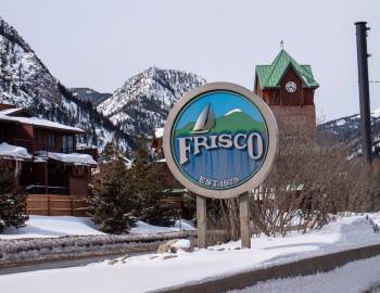 Frisco welcome sign covered in snow