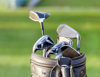 close up on bag of golf clubs