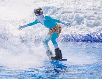 person having fun pond skimming at the end of ski season